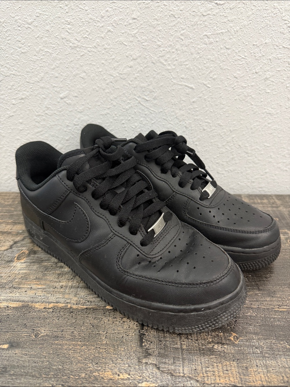 Nike Men's All-Black Leather Low-Top Sneakers